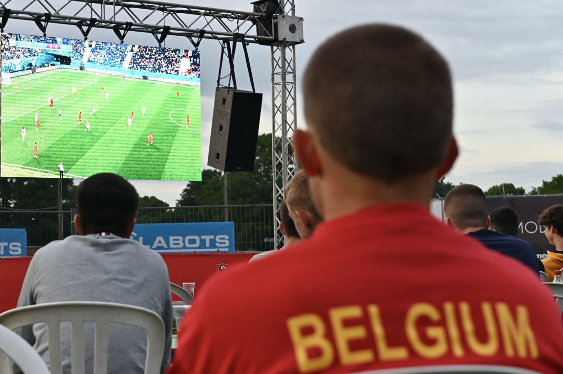 Supporters watching a match on a giant screen